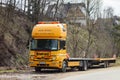 Yellow Mercedes-Benz Atego 1218 truck od Europool company which delivers swimming pools with a trailer Royalty Free Stock Photo