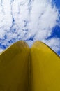 Yellow metal art and blue sky