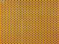 Yellow metal hole or perforated grid background