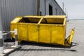 Yellow metal waste skip Royalty Free Stock Photo