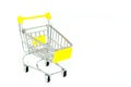 Yellow mini shopping cart or supermarket trolley isolated on white background. Royalty Free Stock Photo