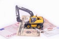 Yellow miniature excavator. rental of construction equipment Royalty Free Stock Photo