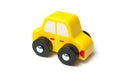 yellow miniature wooden car on white background Royalty Free Stock Photo