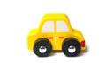 yellow miniature wooden car on white background Royalty Free Stock Photo