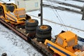 Yellow mining truck disassembled into parts, cab, body, electric motor, drive, wheels, loaded onto a cargo railway platform. Royalty Free Stock Photo