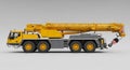 Yellow mobile crane with six large wheels and an extendable boom arm. The crane Royalty Free Stock Photo