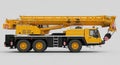 Yellow mobile crane with a telescoping boom. The crane has six wheels, three per Royalty Free Stock Photo