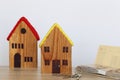 Yellow model house and and banknote on white background, Business investment and real estate concept