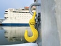 Yellow mooring hook in the port. Royalty Free Stock Photo