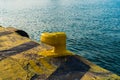 Yellow mooring lines in the seaport. Close-up photo