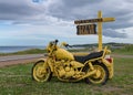 Yellow motorcycle along Cabot Trail