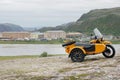 Yellow motorcycle with a sidecar in the background of the city Royalty Free Stock Photo