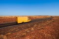 Yellow moving truck in the desert