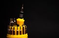 yellow multifunctional set of small screwdrivers on a black background