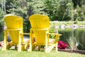 Yellow Muskoka chairs with a view Royalty Free Stock Photo