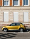 Yellow mustard color of new Volkswagen VW T-Roc SUV parked in front of French Royalty Free Stock Photo