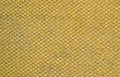 Yellow mustard colored fabric swatch samples texture unprinted suiting fabric from above .Cloth texture Royalty Free Stock Photo