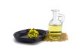 Yellow mustard flowers with decanter of oil