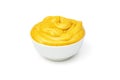 Yellow mustard sauce in white ceramic bowl isolated on white background. Royalty Free Stock Photo