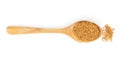 Yellow mustard seeds in wooden spoon isolated on white background, top view Royalty Free Stock Photo