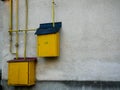 Yellow natural gas pipes and boxes close up on dirty wall Royalty Free Stock Photo