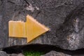 Yellow navigation symbol on the rock wall of a natural mountain, Limestone mountains,to the right Royalty Free Stock Photo