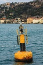 Yellow navigational buoy marker in a river