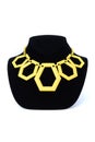 Yellow necklace on a mannequin isolated on white Royalty Free Stock Photo