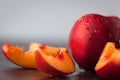 Yellow nectarine peach with water drops.