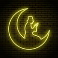 Yellow neon sign. Ramadan Kareem, moon and the praying person.