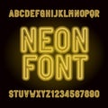 Yellow neon tube alphabet font. Neon color letters, numbers and symbols.