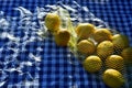 Lemons in yellow net bag Royalty Free Stock Photo