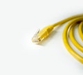 yellow network cable on white background. cat 5 wire with rj45 tip. Royalty Free Stock Photo