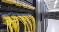 Yellow Network Cables Connected to Server Rack in Data Center