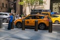 A yellow New York City taxi cab on a busy Manhattan street during rush hour Royalty Free Stock Photo