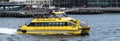 Yellow New YorK Water Taxi taking off from the pier Royalty Free Stock Photo