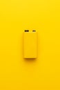 Blank nine-volt battery on the yellow background Royalty Free Stock Photo