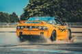 Yellow Nissan drift car in action