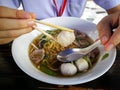 Yellow noodles with meat ball in clear broth or soup Royalty Free Stock Photo