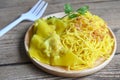 Yellow noodles on white plate and pork dumplings wooden background , instant noodles yellow noodles rice vermicelli food with