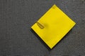 Yellow note and clip into blue corkboard Royalty Free Stock Photo