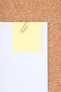Yellow Note Paper with Paperclip on White Paper ov Royalty Free Stock Photo