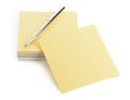 Yellow note paper and a pen Royalty Free Stock Photo