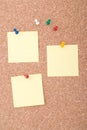 Yellow Note Papers With Tacks On Cork Surface Royalty Free Stock Photo