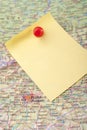 Yellow Note and red pin on map Royalty Free Stock Photo