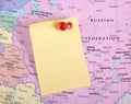 Yellow Note and red pin on map Royalty Free Stock Photo
