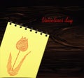 Yellow notebook. Drawn by hand. Line in the shape of tulip flower. Empty space for text. Vector on wooden background