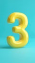 Glossy Yellow Number Three Isolated on a Blue Background for Decorative Design Royalty Free Stock Photo