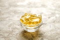 Yellow nutritional supplement pills full of Omega 3 fatty acids. Royalty Free Stock Photo