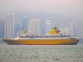 Yellow Ocean Liner in Frontof City Skyline